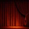 a set of dark red velvet closed theatre curtains